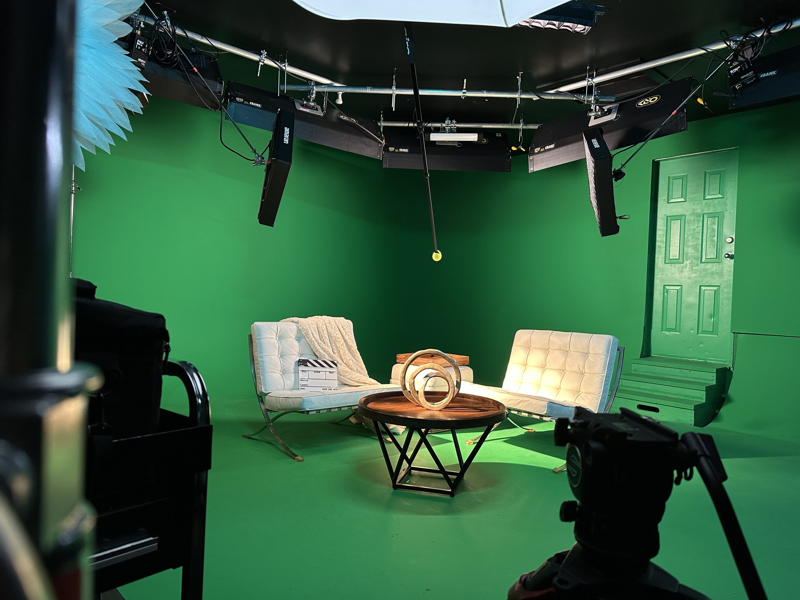 The MediaHive green screen cyc with two chairs set for an interview