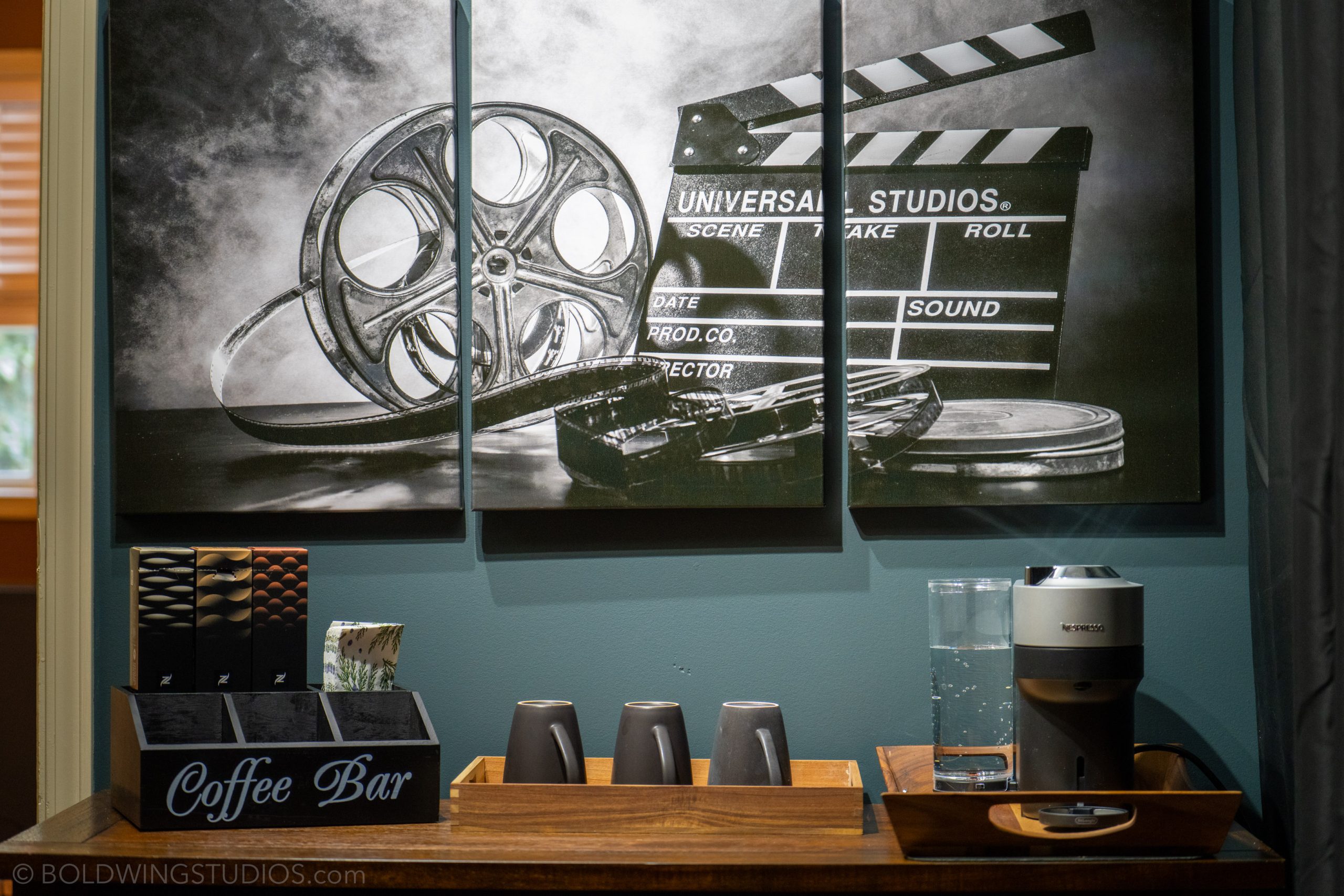 Film-reel artwork above the coffee bar