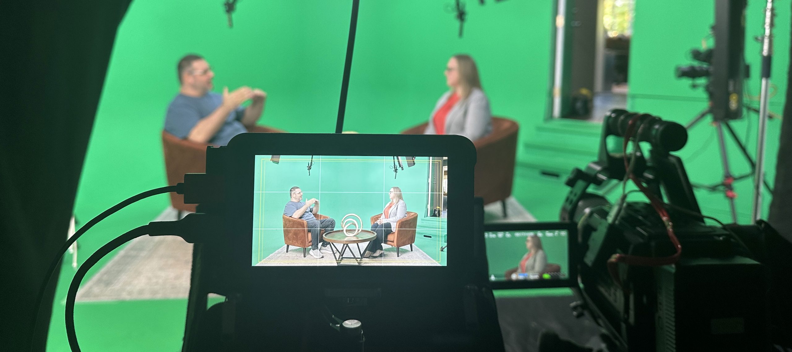 A camera monitor showing the composited virtual set during a green screen shoot